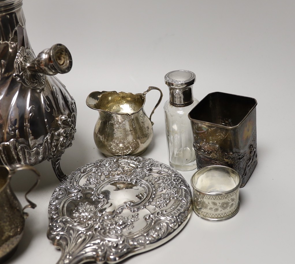 A late 19th/early 20th century French white metal coffee or chocolate pot (lacking handle), gross 21.5oz, a silver cream jug and sugar bowl, five French white metal mounted toilet jars, three silver napkin rings, a silve